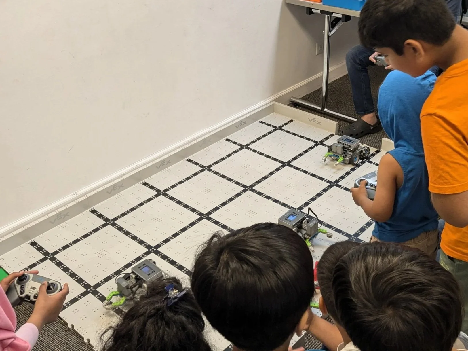 Students building robots and competing in Brain Busters robot soccer in robot class in Chicago and Glendale Heights