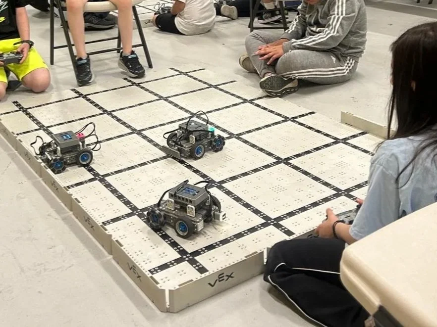 Students building robots in a Brain Busters robotics class in Chicago