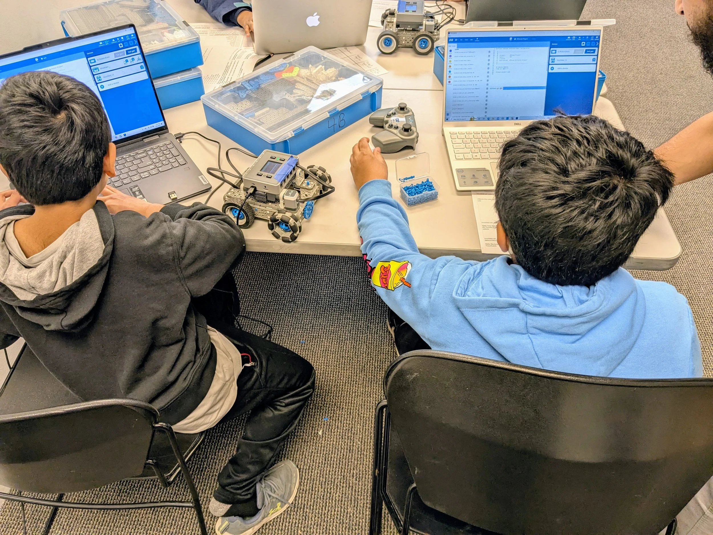 Students coding and building robots in a Brain Busters robotics class in Chicago