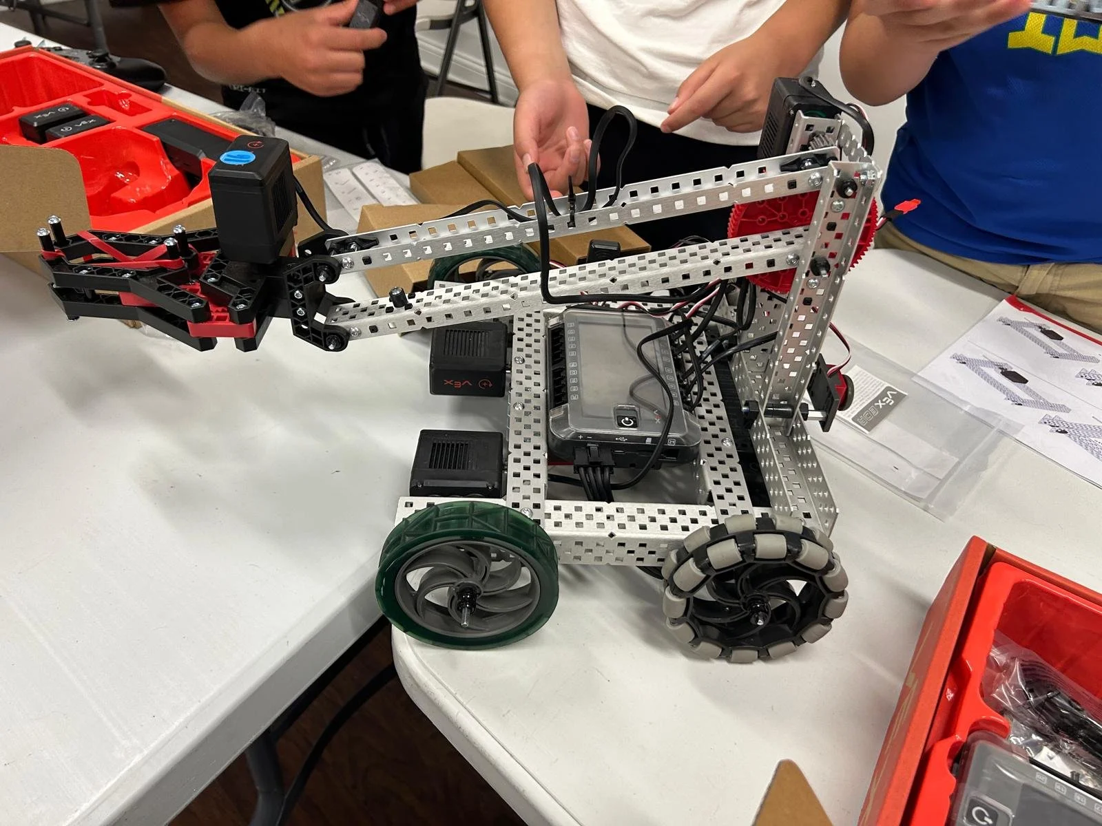 Students building robots in a Brain Busters robotics class in Chicago and Willowbrook