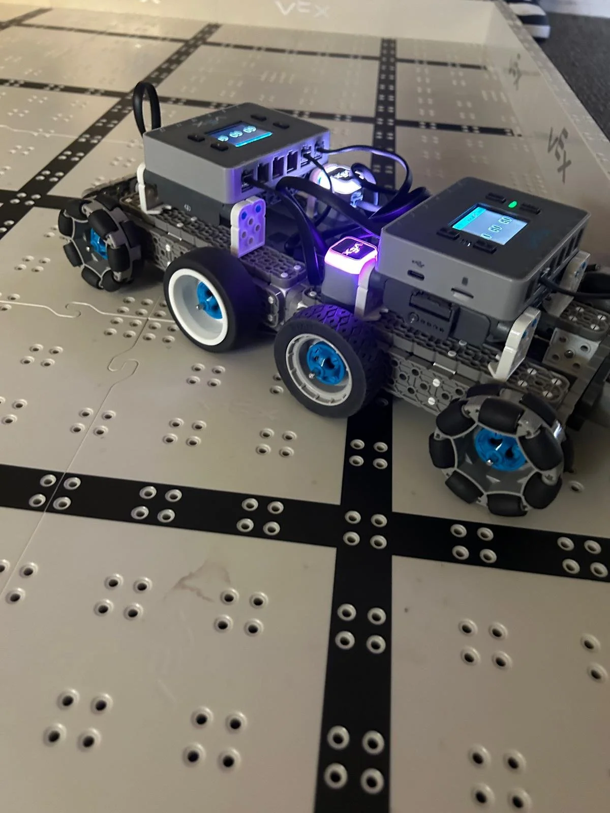 Two student-built robots competing in a Brain Busters Robot Freeze Tag STEM class
