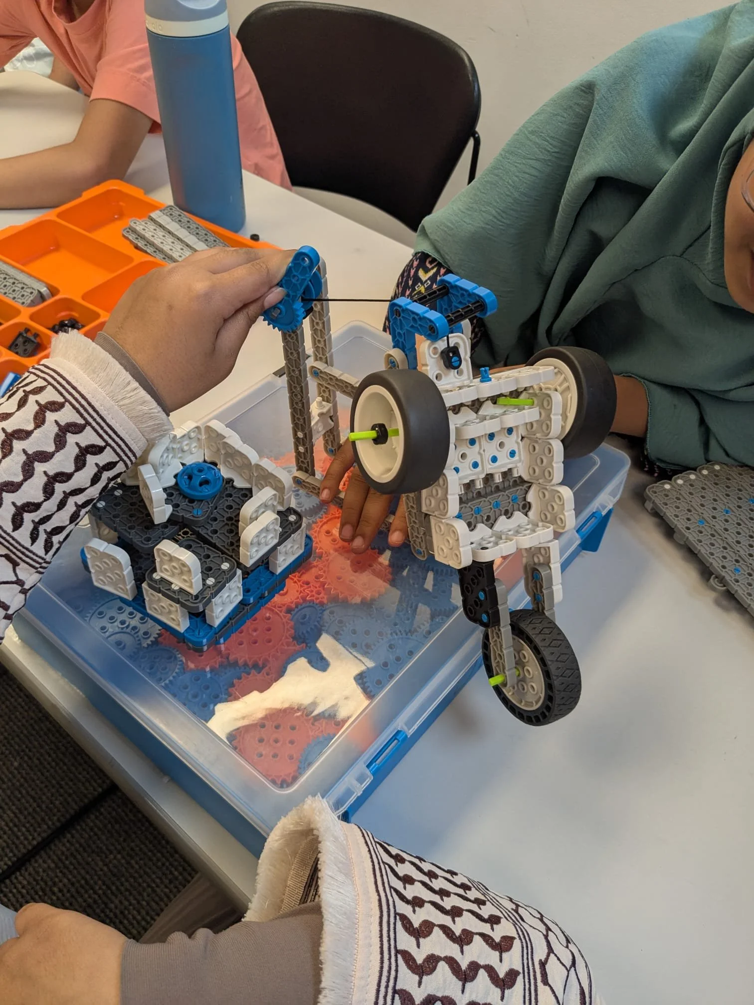 Students testing a pulley they built during a STEM summer camp