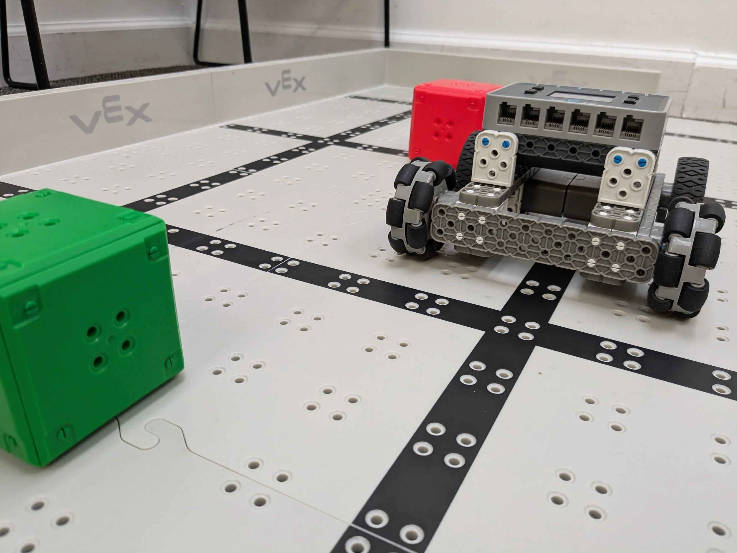 Students competing in VEX robotics Battle of the Bots at STEM summer camp near Chicago suburbs