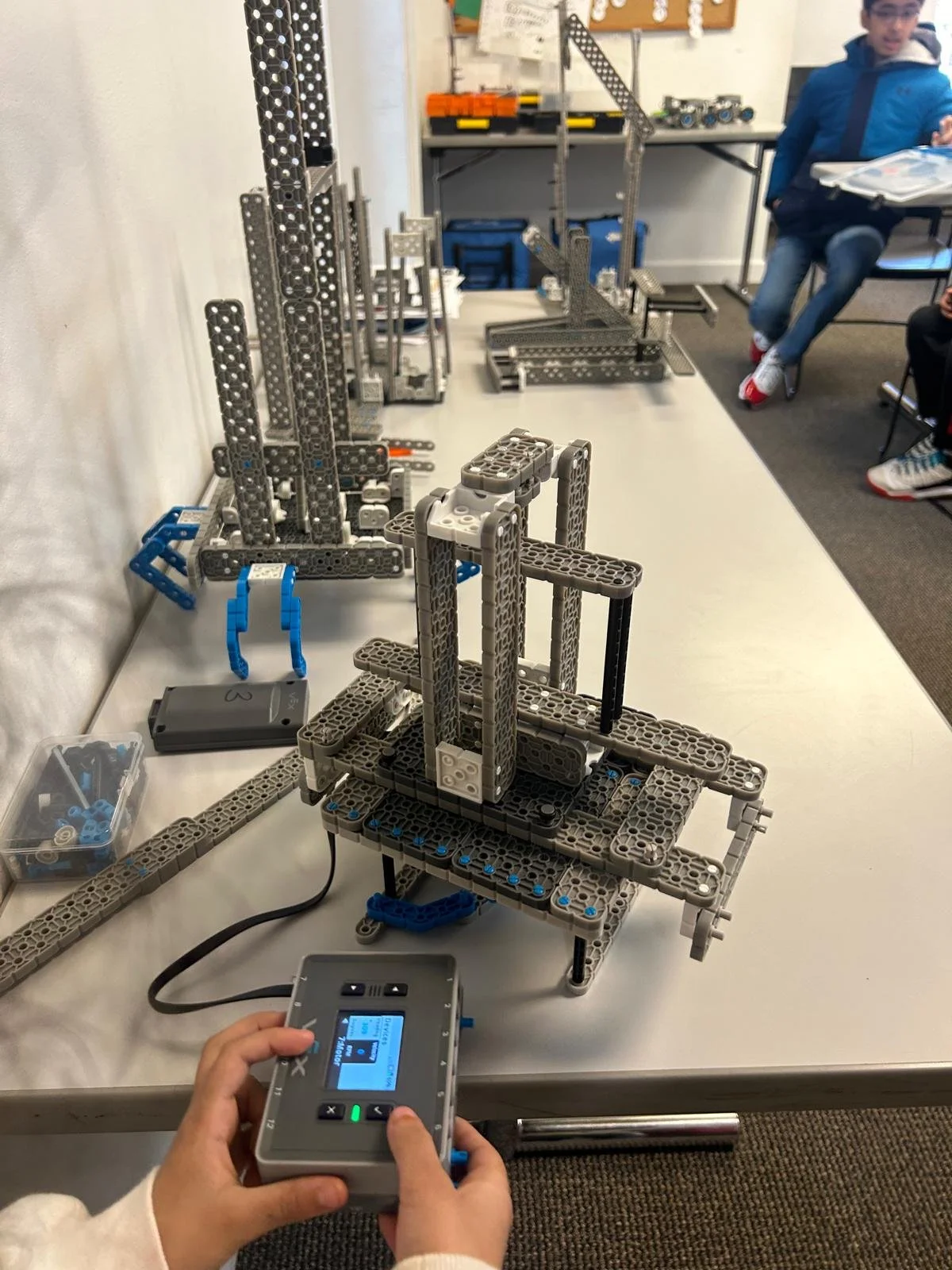 students building tallest tower to test on earthquake simulator in a Brain Busters stem workshop in chicago and glendale heights