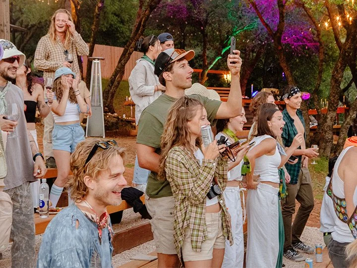 Group of young event attendees enjoying a concert in the Upper Vista amphitheater at Deloro Valley