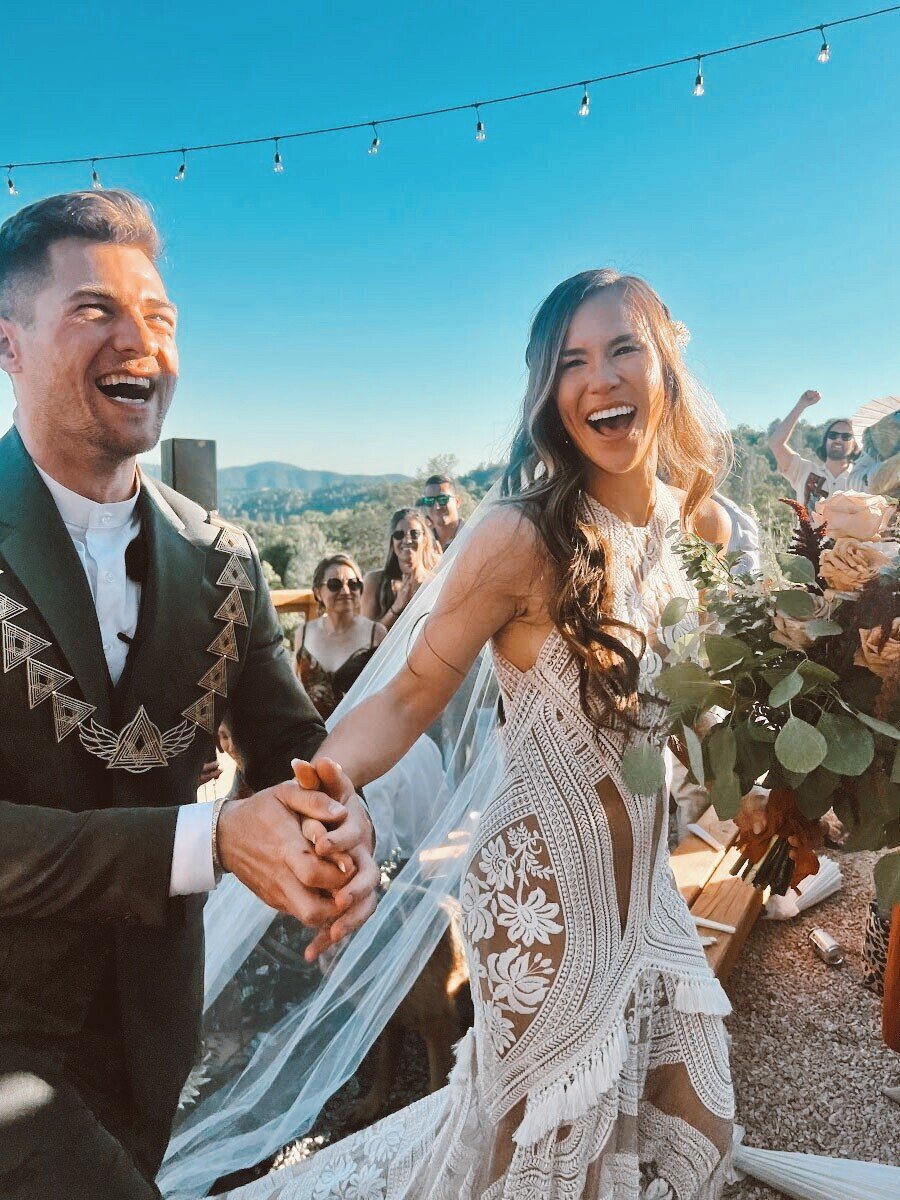 Happy bride and groom just married at end of wedding ceremony at Upper Vista amphitheater