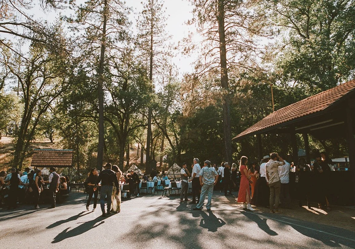 Base camp picnic area large group gathering for evening barbecue in beautiful outdoor setting at Deloro Valley