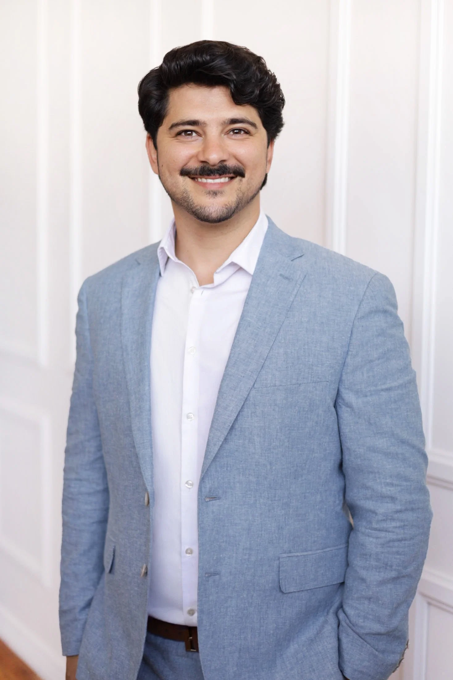 Professional real estate headshot photographed in a Little Italy studio in San Diego