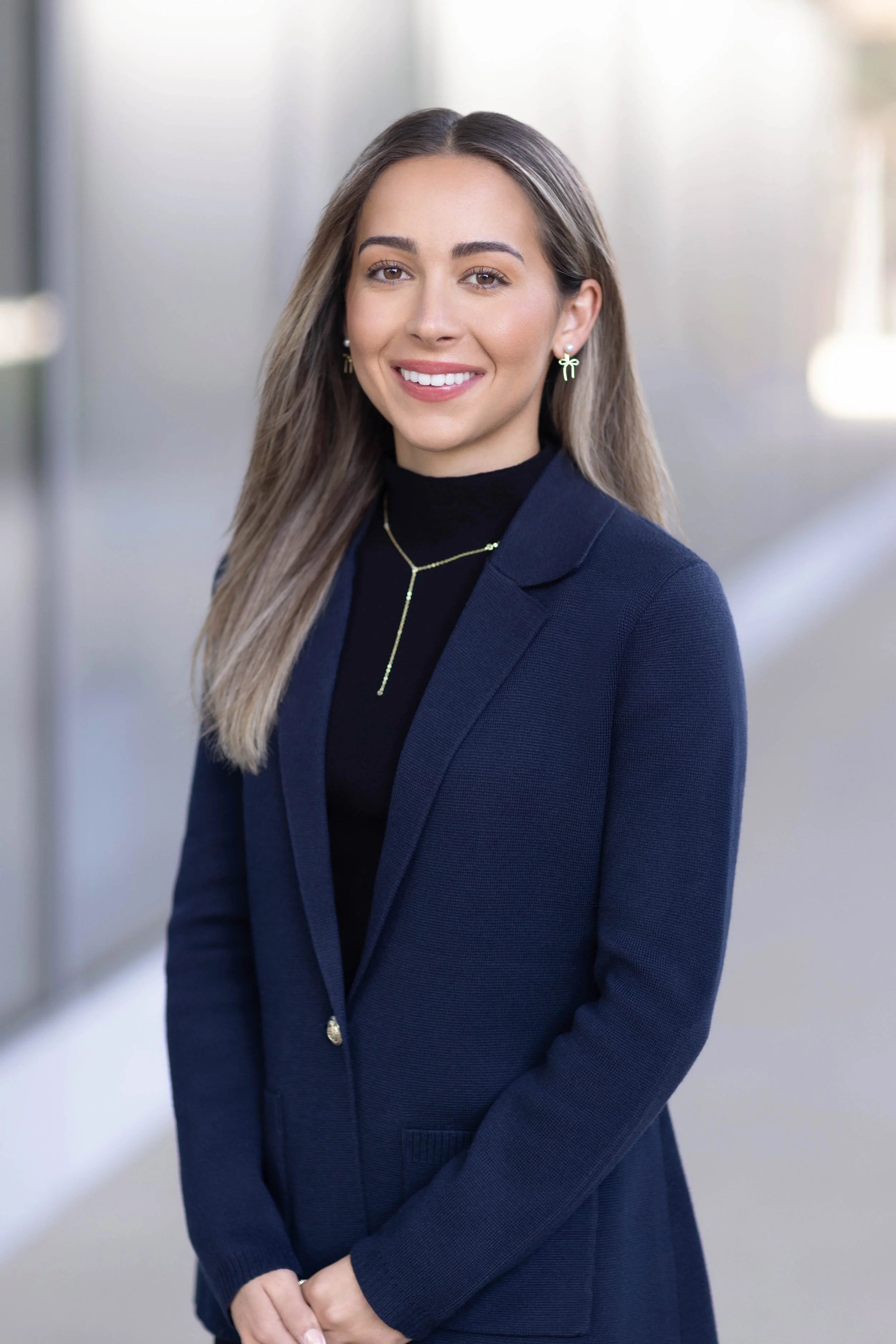 Professional finance headshot of an investment banking professional photographed in a modern La Jolla office building