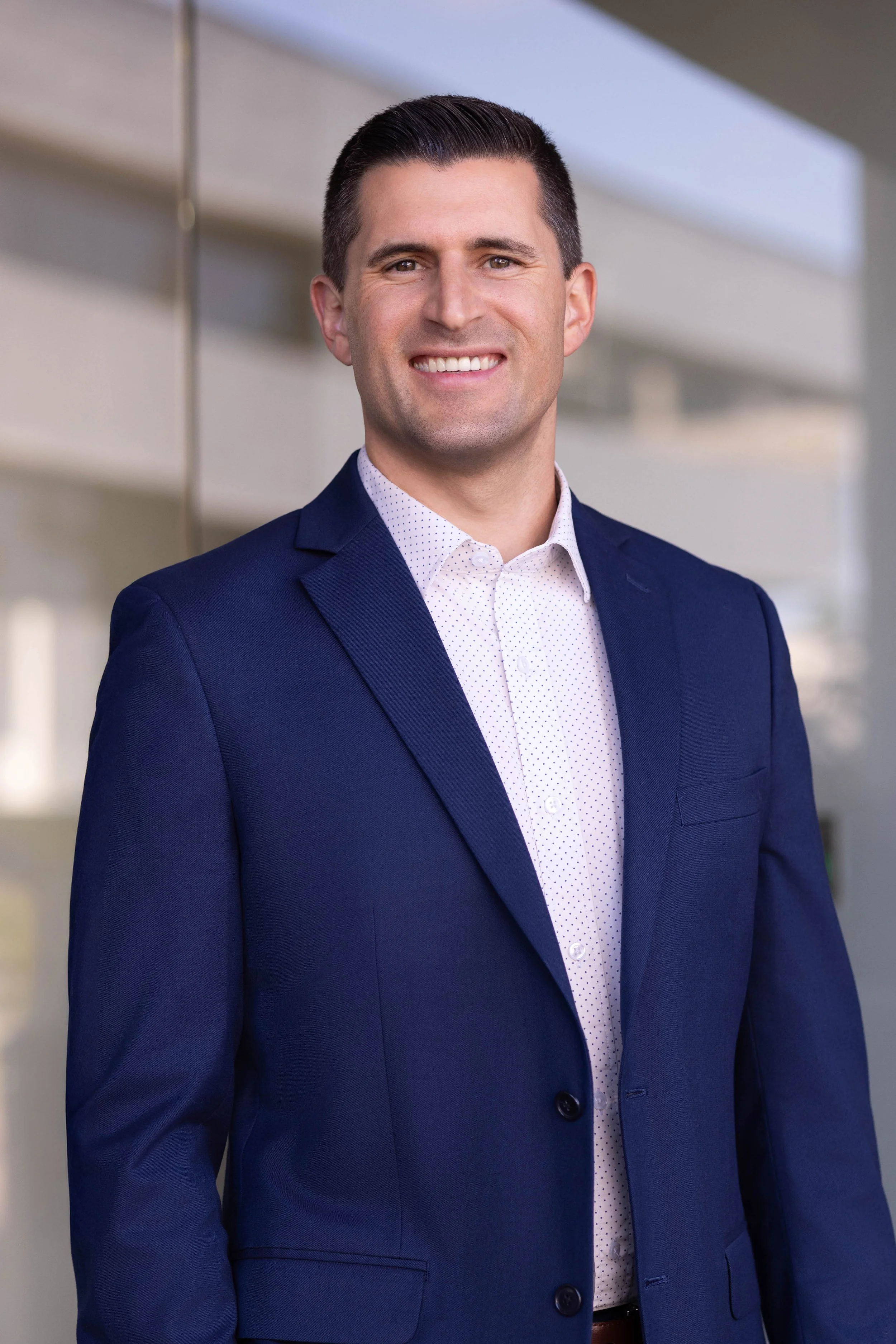 Corporate headshot photographed in an outdoor office environment using natural light