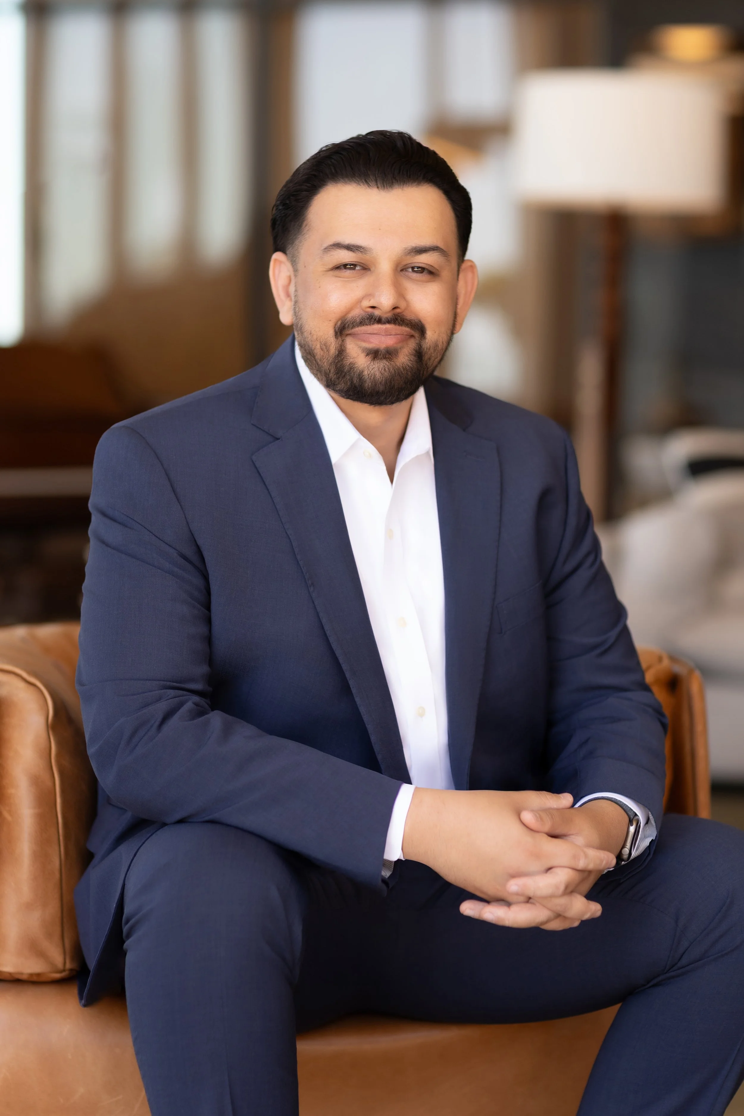 Professional business headshot of a man in a navy suit photographed by a San Diego corporate headshot photographer