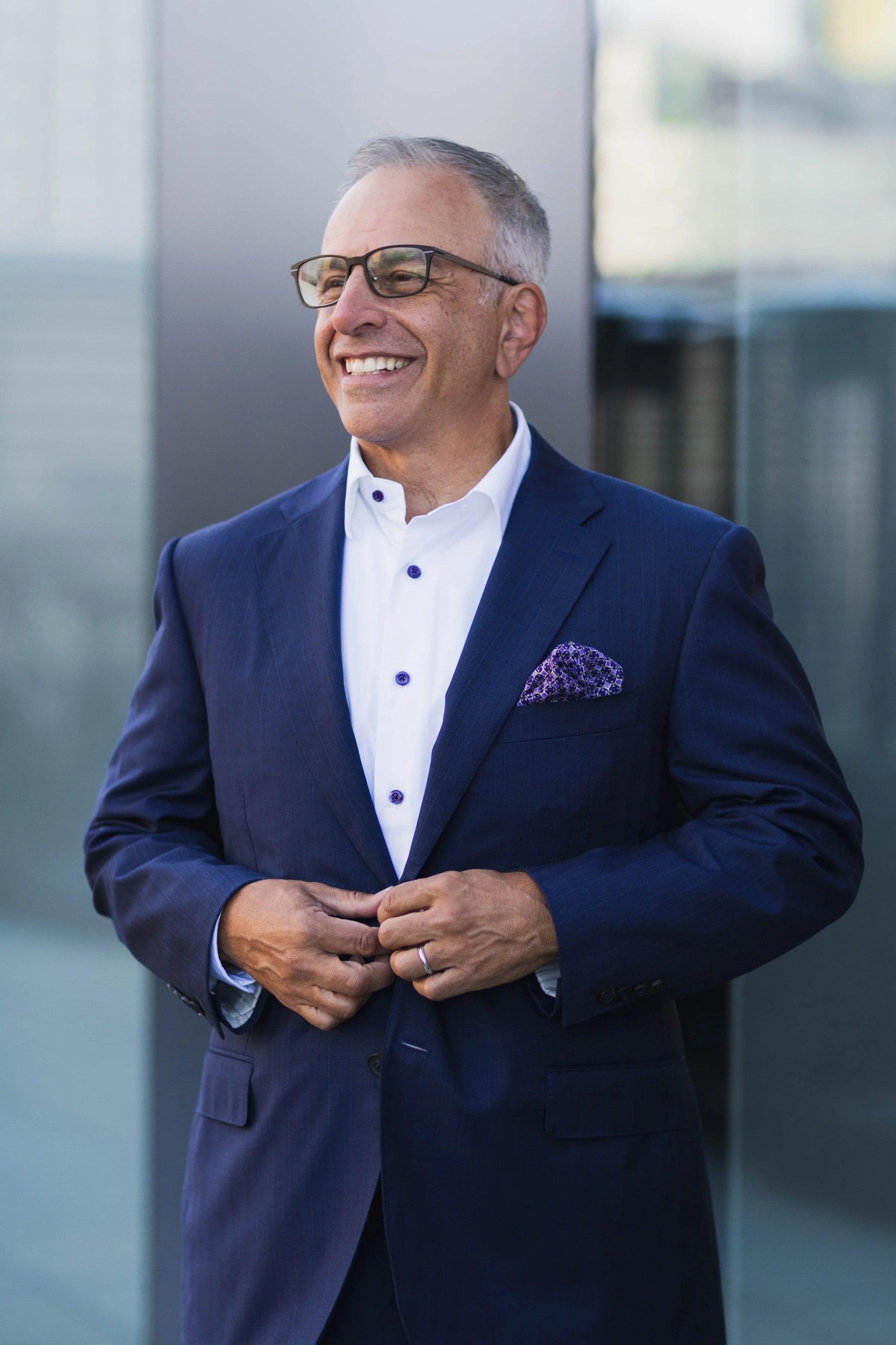 Executive business headshot of an investment banker photographed in San Diego with a clean, professional style