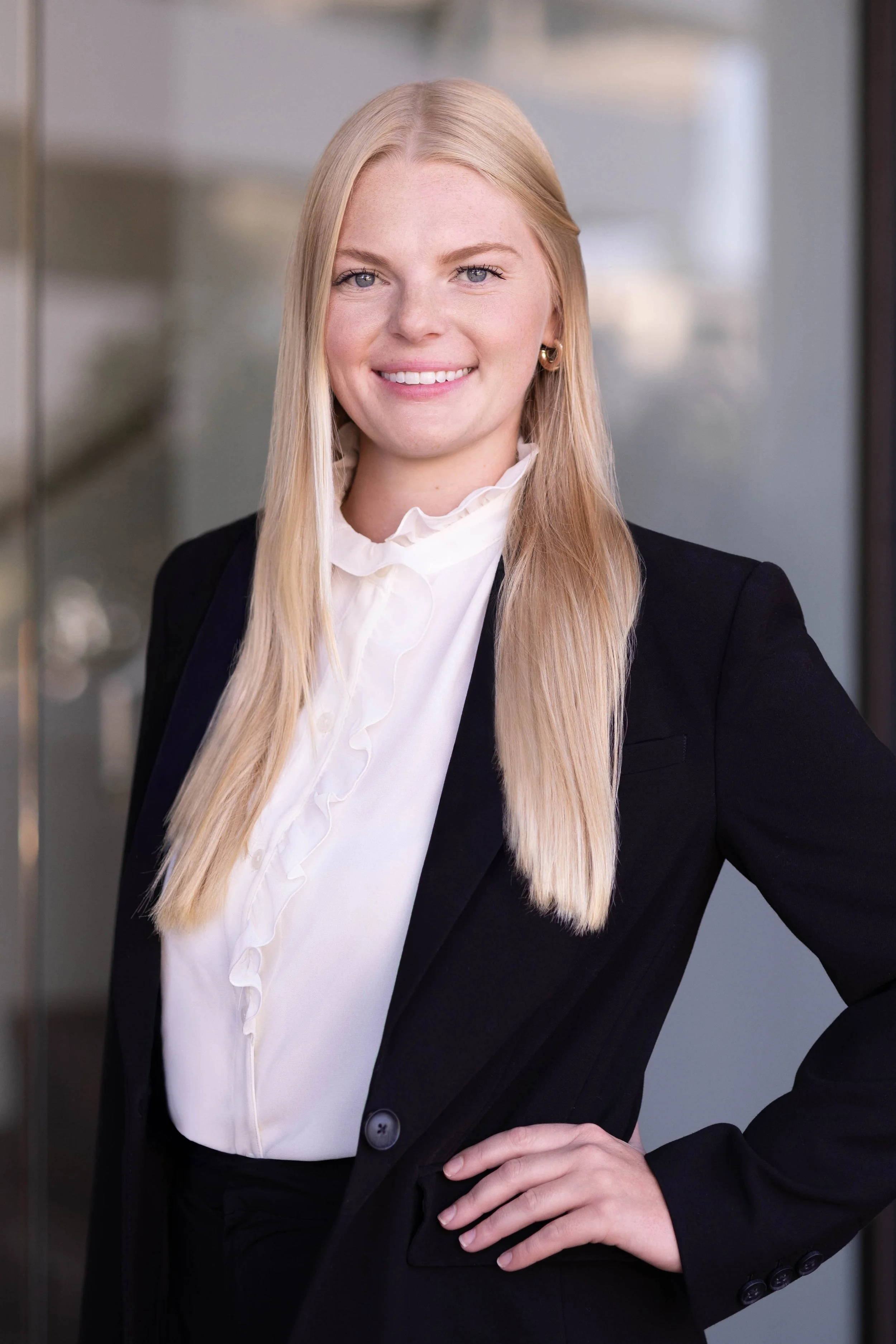 Professional business headshot for a Del Mar financial planning group photographed in a modern office environment