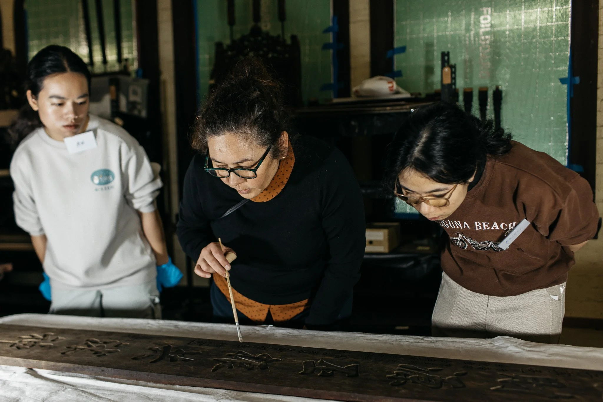  Associate Professor Nicole Tse demonstrating and discussing conservation cleaning with volunteers at See Yup Temple. Photo: Marie Luise 