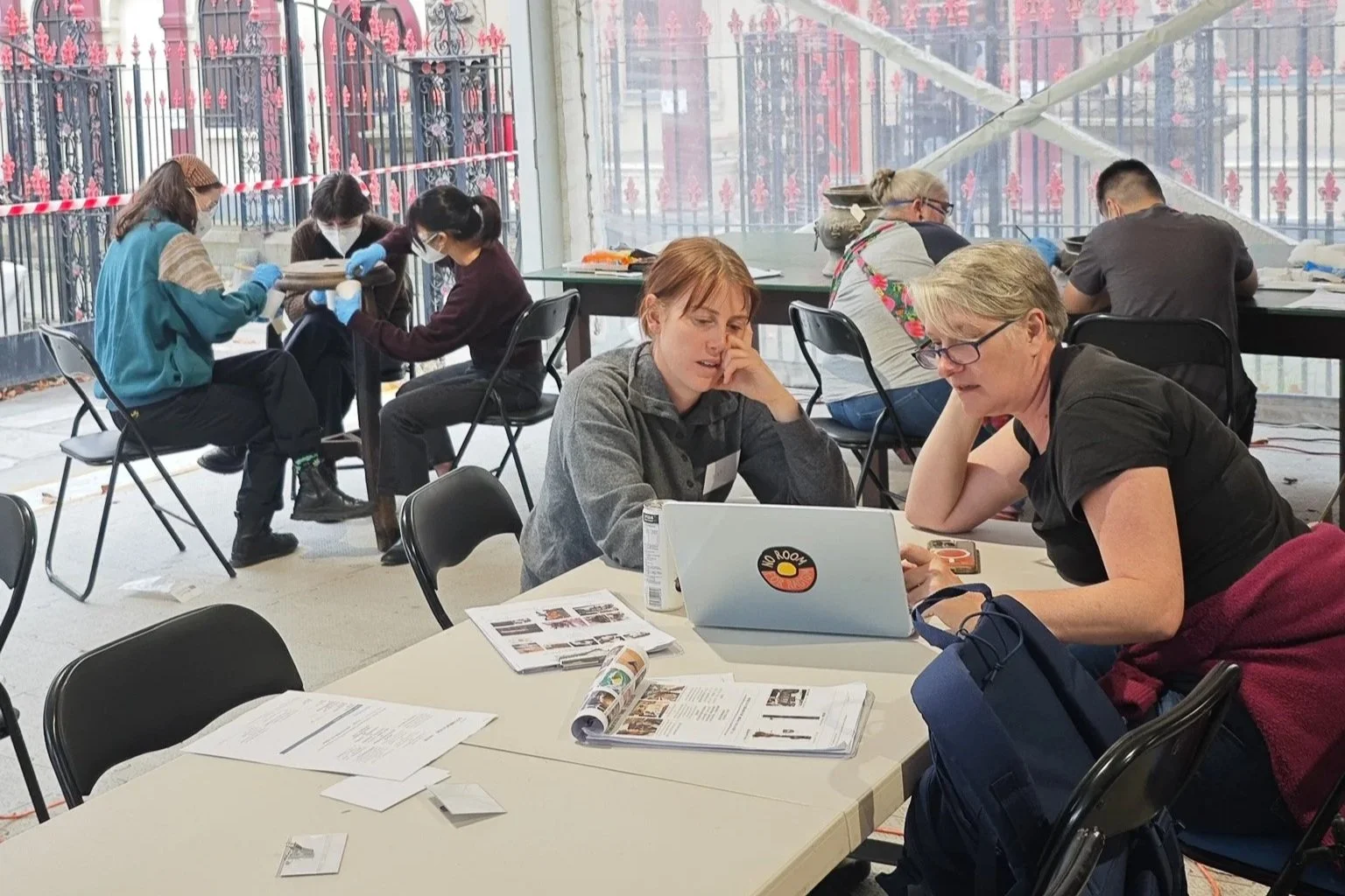  Dr Sophie Couchman working with volunteers on object documentation during a conservation workshop at See Yup Temple. Photo: Danni Lin 