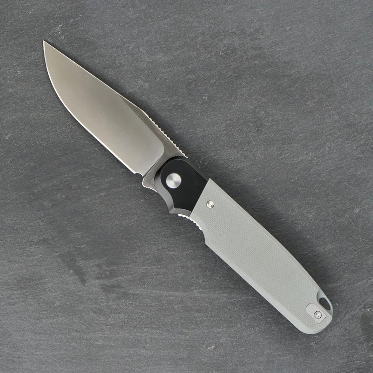 Rapax Buddy with a gray handle and finger choil, shown open.