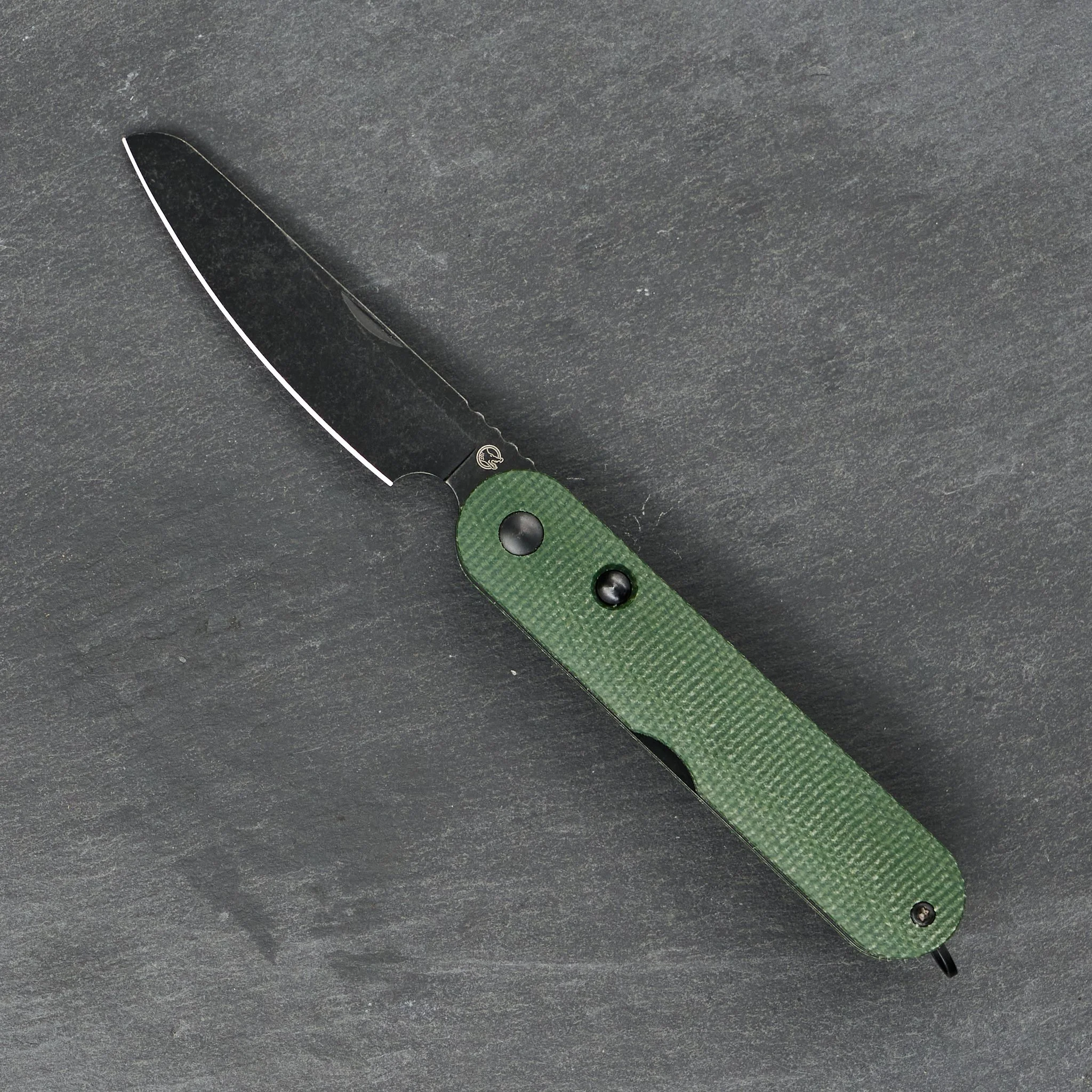 Rapax Mimi with a sheepsfoot blade and green handle, shown open.