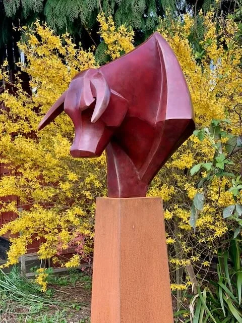 the large red bull is available in bronze resin or bronze.