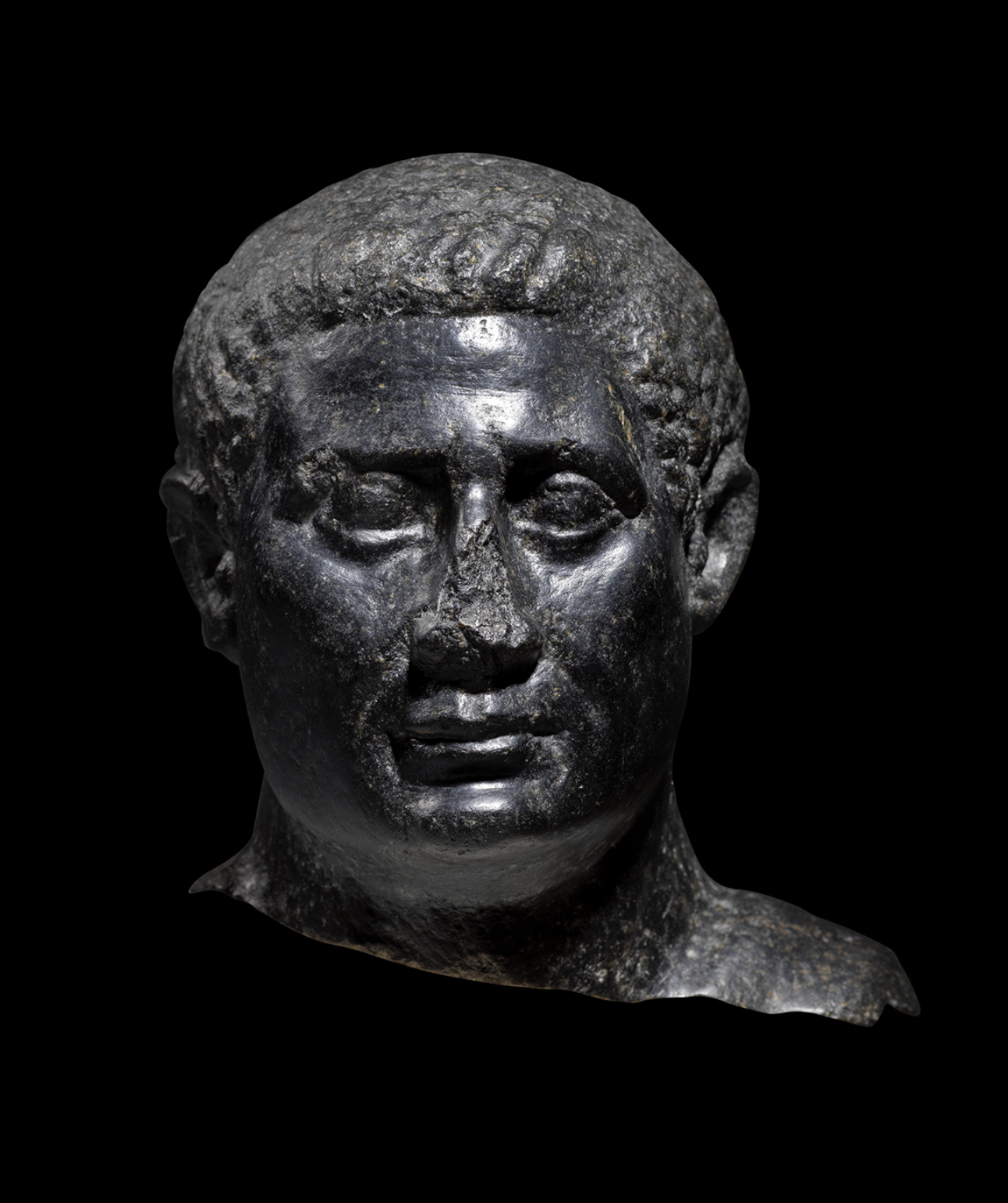 Egyptian Basalt Portrait Head of a Man
Ptolemaic Period, c.irca 100-30 BC
Height 15.6 cm, 
Reputedly found at Bubastis; Hilton-Price Collection, sold Sothebys, 1911;  Private collection, Ireland; Sold Sotheby's, New York, June 5th, 1999
