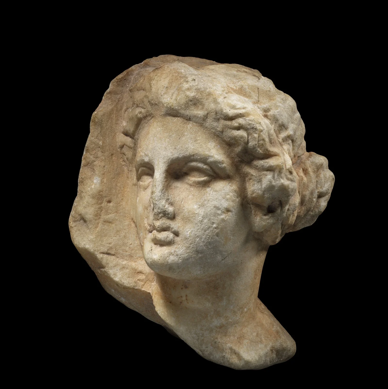 Marble head of a woman in high relief
Attic, second half 4th century BC
Height: 20 cm, 
Private collection Switzerland, acquired 1960s, and thence by descent