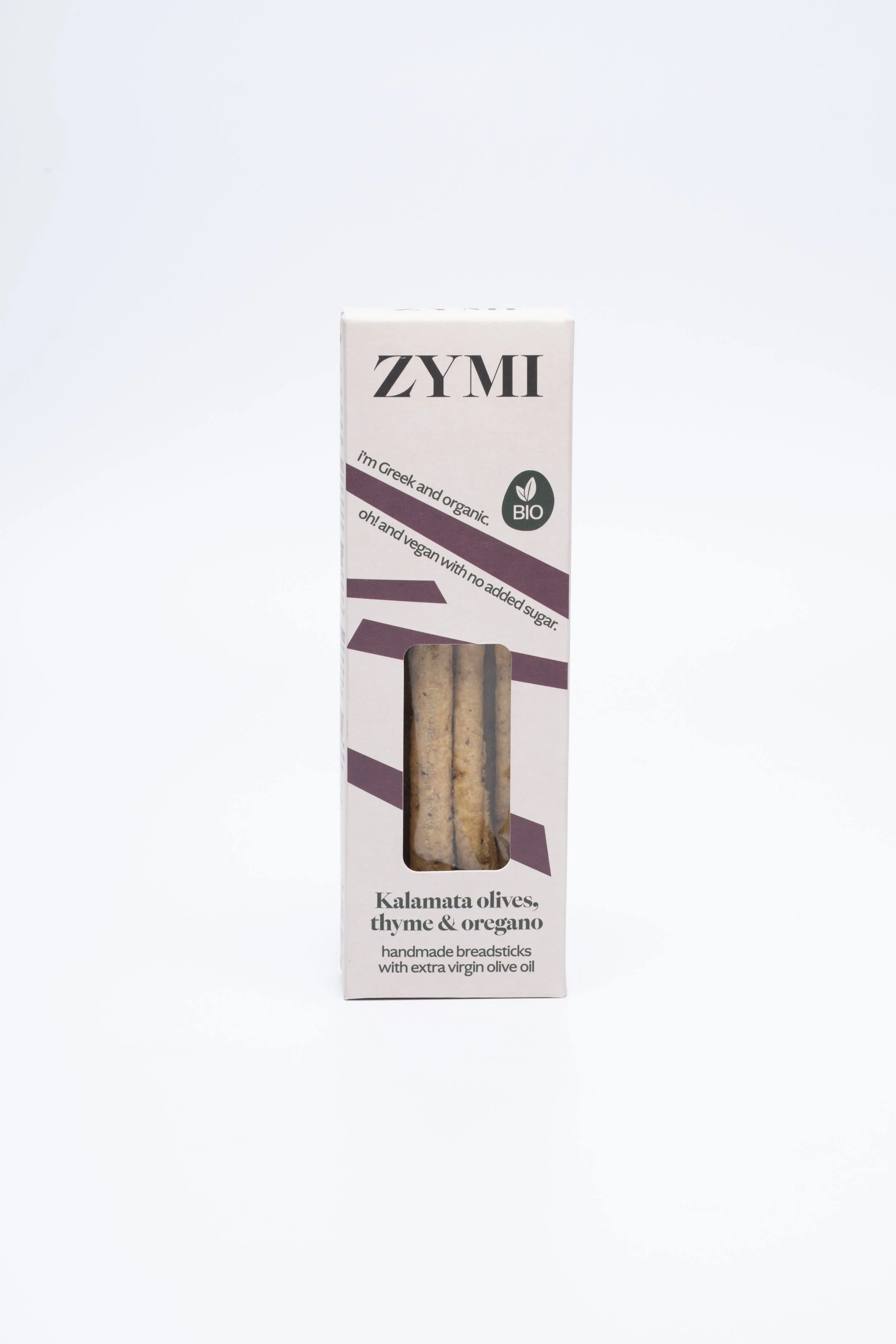 ZYMI product box in light colour with purple lines, showing kalamata olives, thyme & oregano breadsticks through a window cutout.