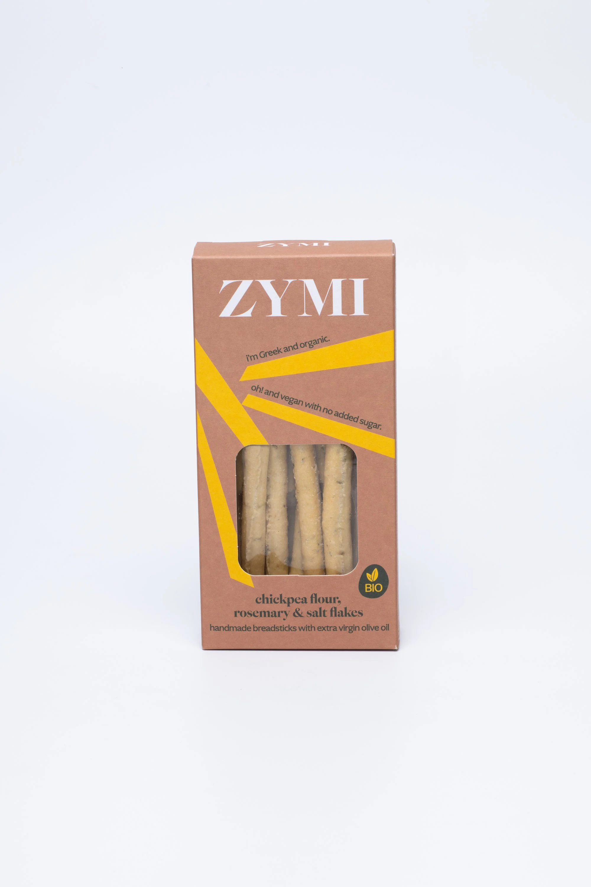 ZYMI product box in light colour with light yellow lines, showing chickpea flour, rosemary & salt flakes breadsticks through a window cutout.