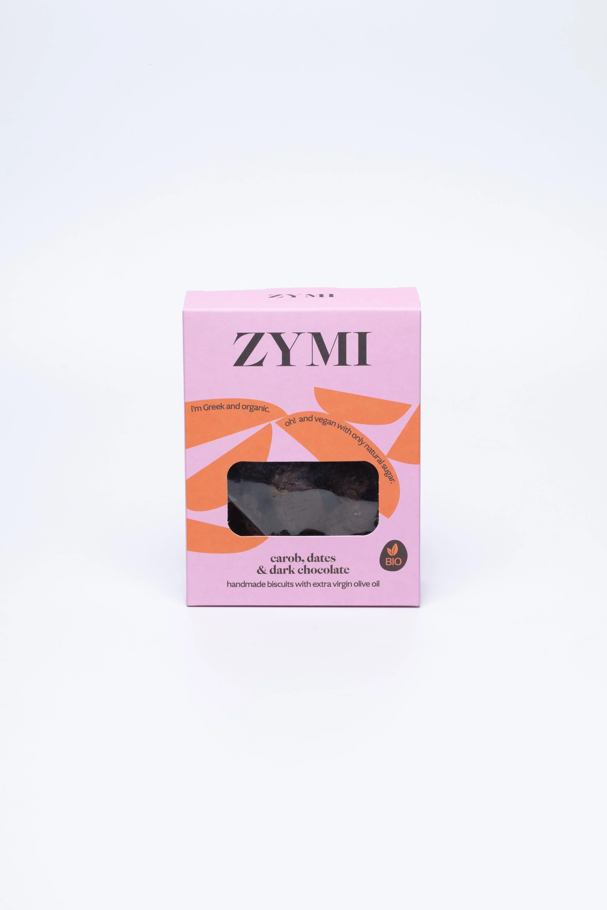 ZYMI product box in light purple with orange details, showing carob, dark chocolate & dates biscuits through a window cutout.
