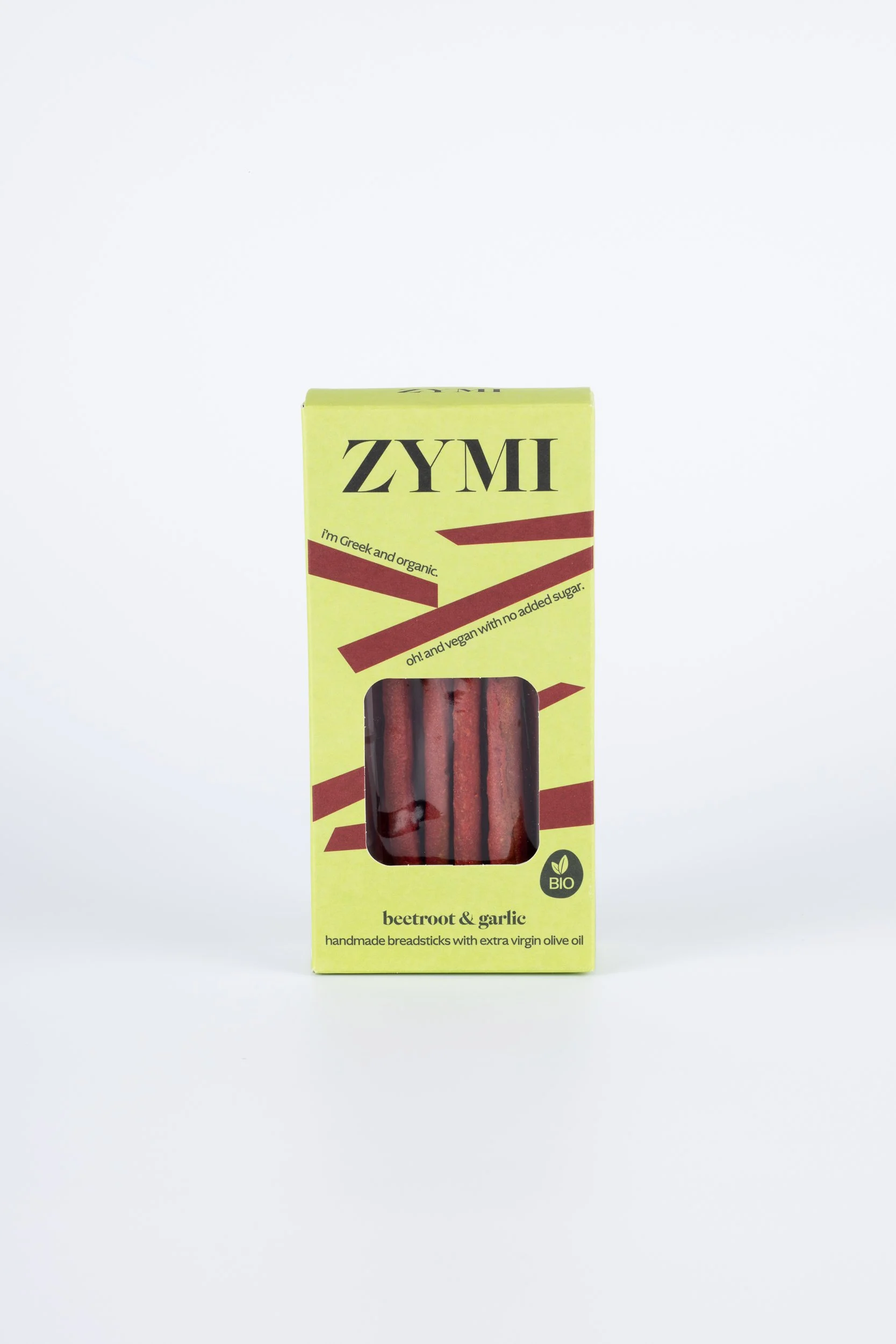 ZYMI product box in light green colour with purple lines, showing beetroot and garlic breadsticks through a window cutout.