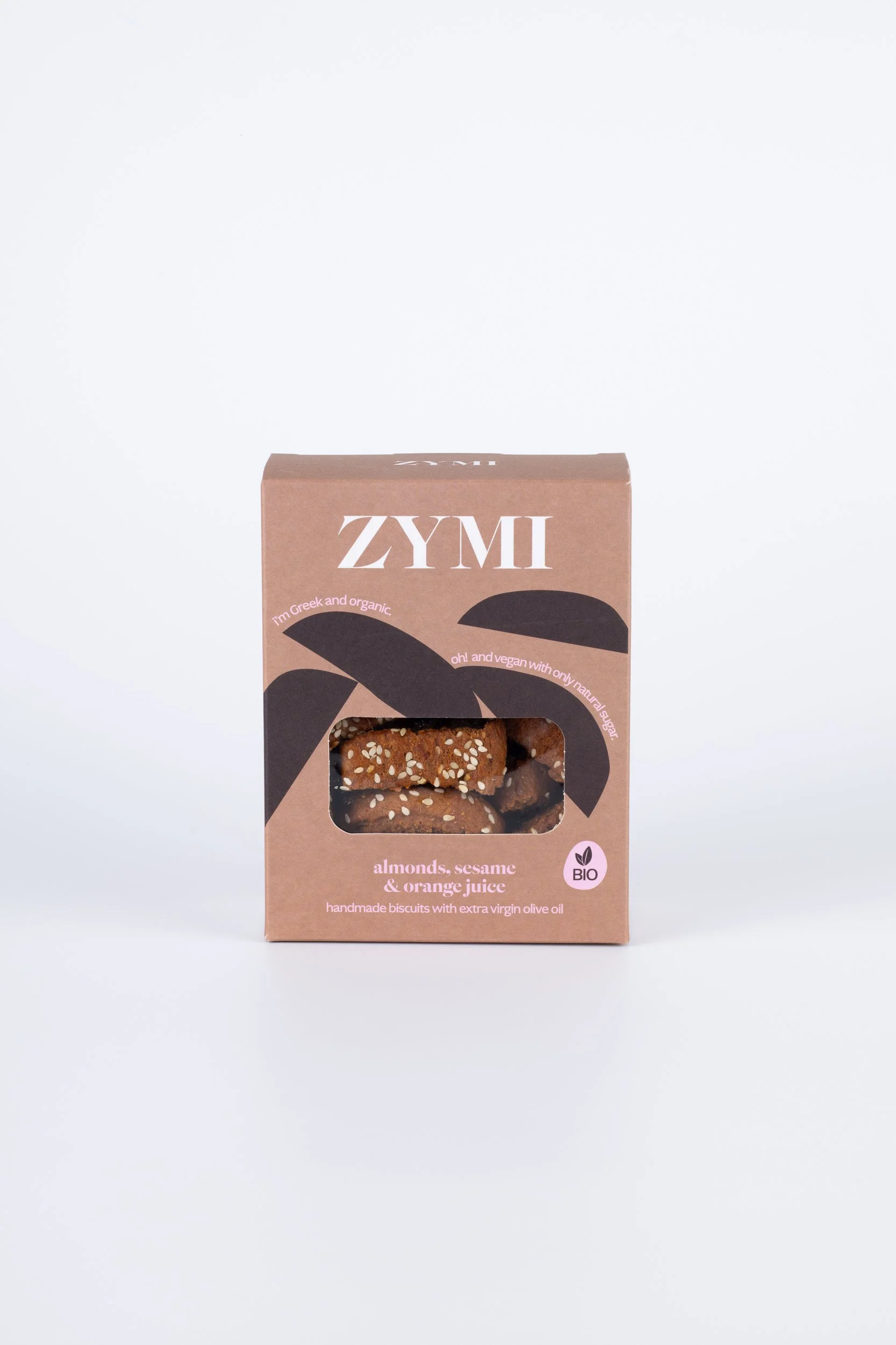 ZYMI product box in light brown with dark brown details, showing sesame, almonds & orange juice biscuits through a window cutout.