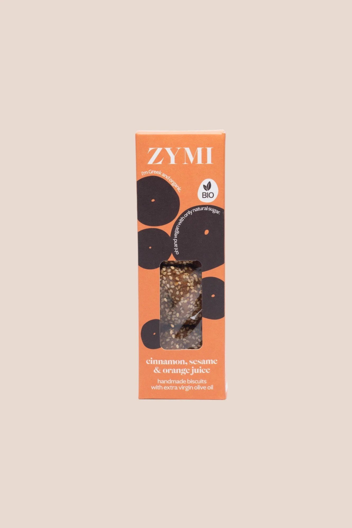 Orange box of biscuits with cinnamon, sesame, and orange juice, labeled ZYMI, with a window showing sesame-coated cookies inside, placed on a beige background with text describing the biscuits.