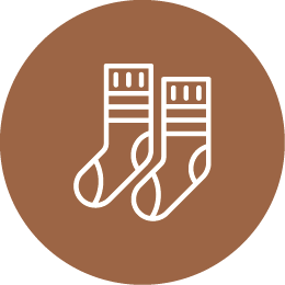 Icon of two Christmas stockings on a brown circular background.
