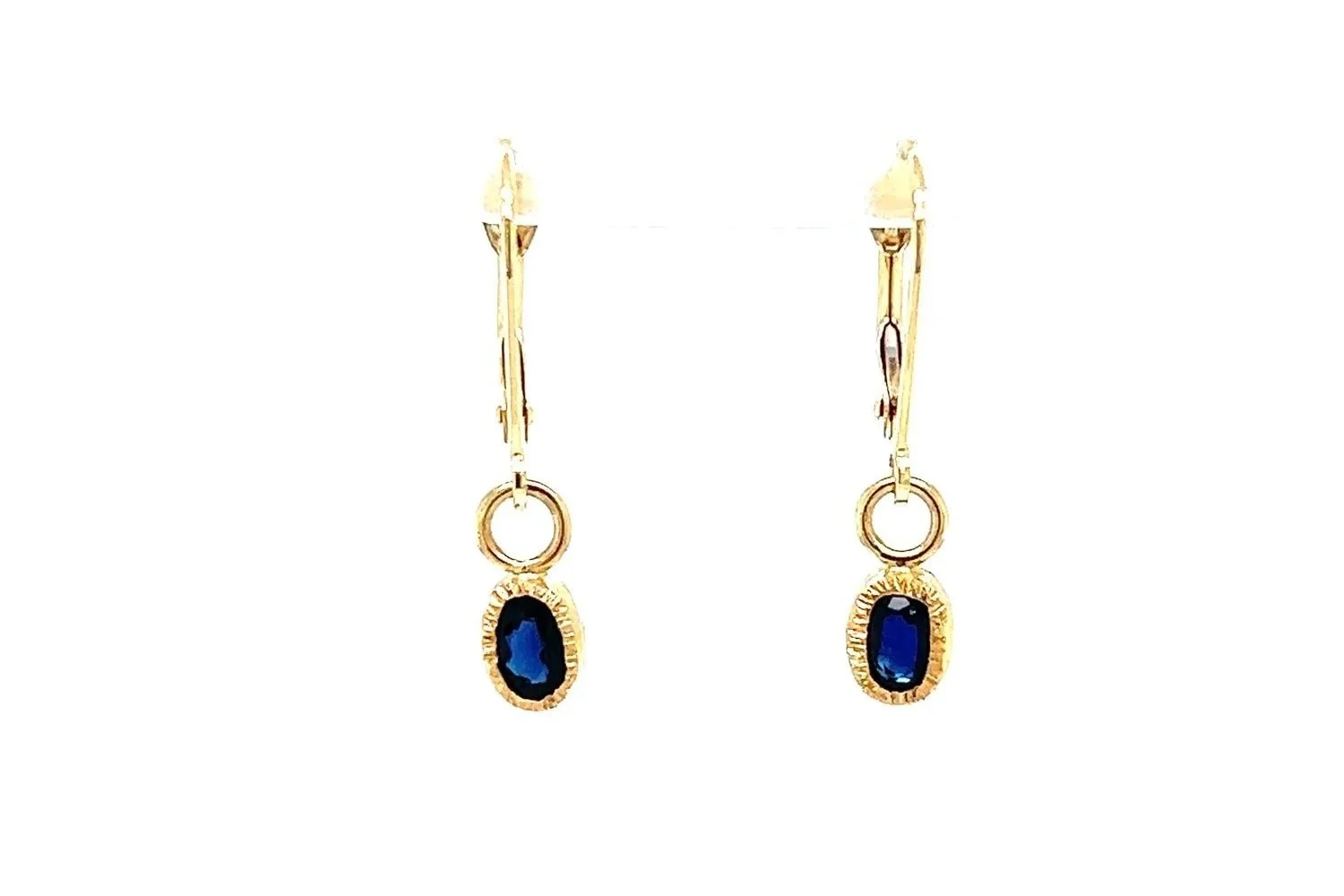 Faceted AA sapphires that are set in 14k gold and attached to 14k gold lever backs by Erika Laureano Design, North Bend WA