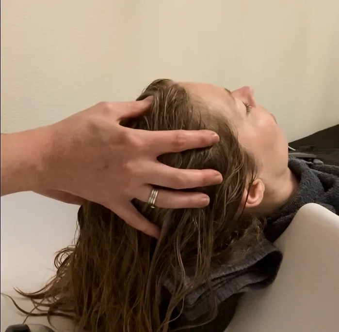 Cranial Reflexology session using the Bergman Method; gentle pressure is applied to reflex points on the skull to release tension, support the nervous system, and promote deep relaxation and energetic flow. 
