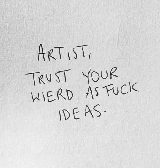 Handwritten note on white paper that reads, "Artist, trust your weird as fuck ideas."