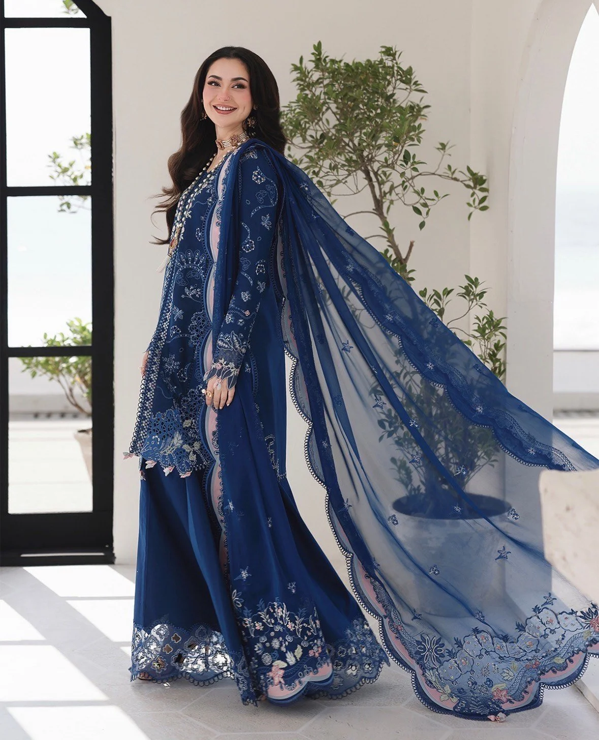 Soft pastel embroidered suit featuring delicate lace detailing and subtle embellishments. A graceful ensemble that radiates elegance, perfect for daytime festivities and formal gatherings.
