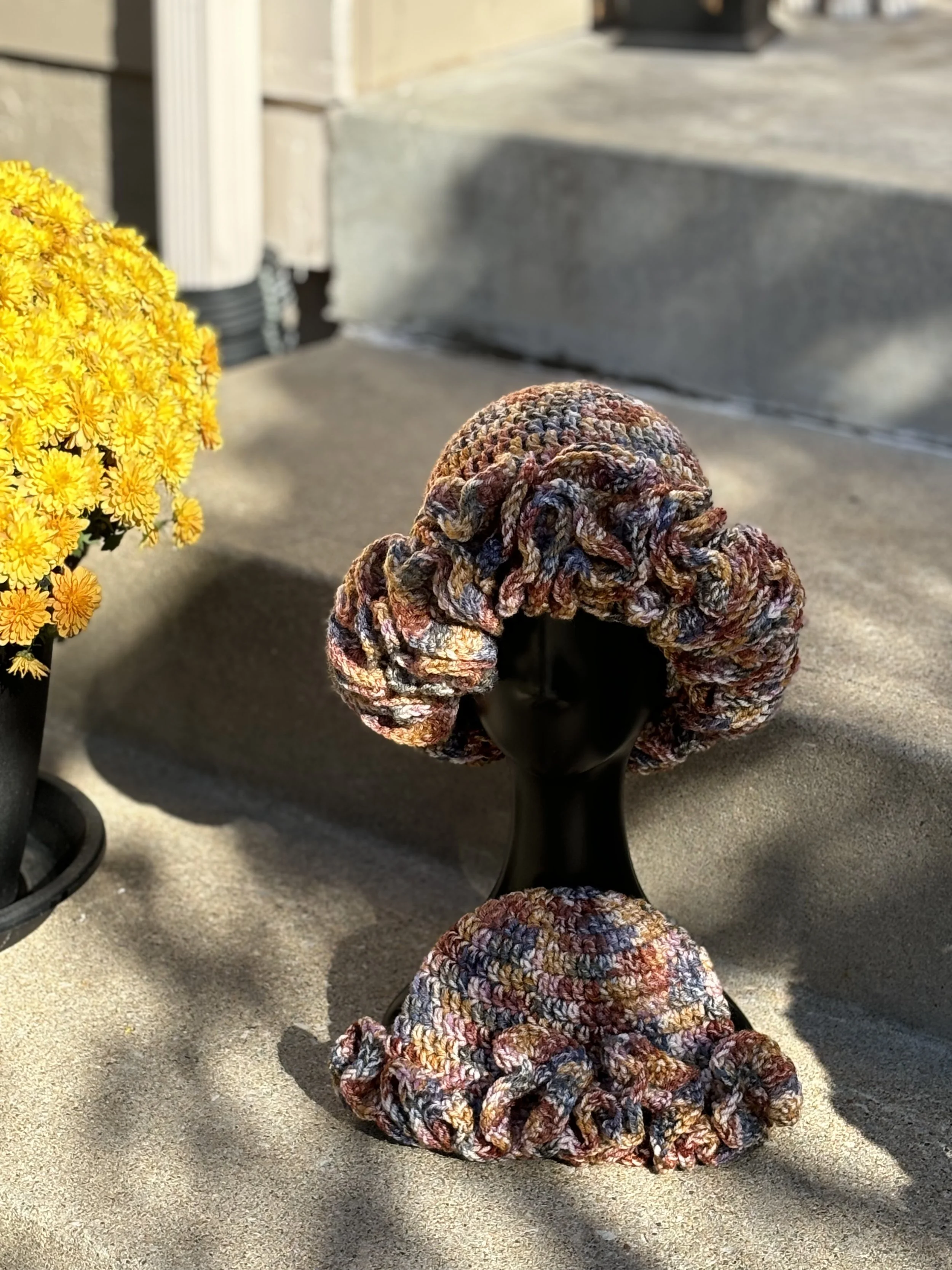 Handmade crochet hat and scarf on mannequin