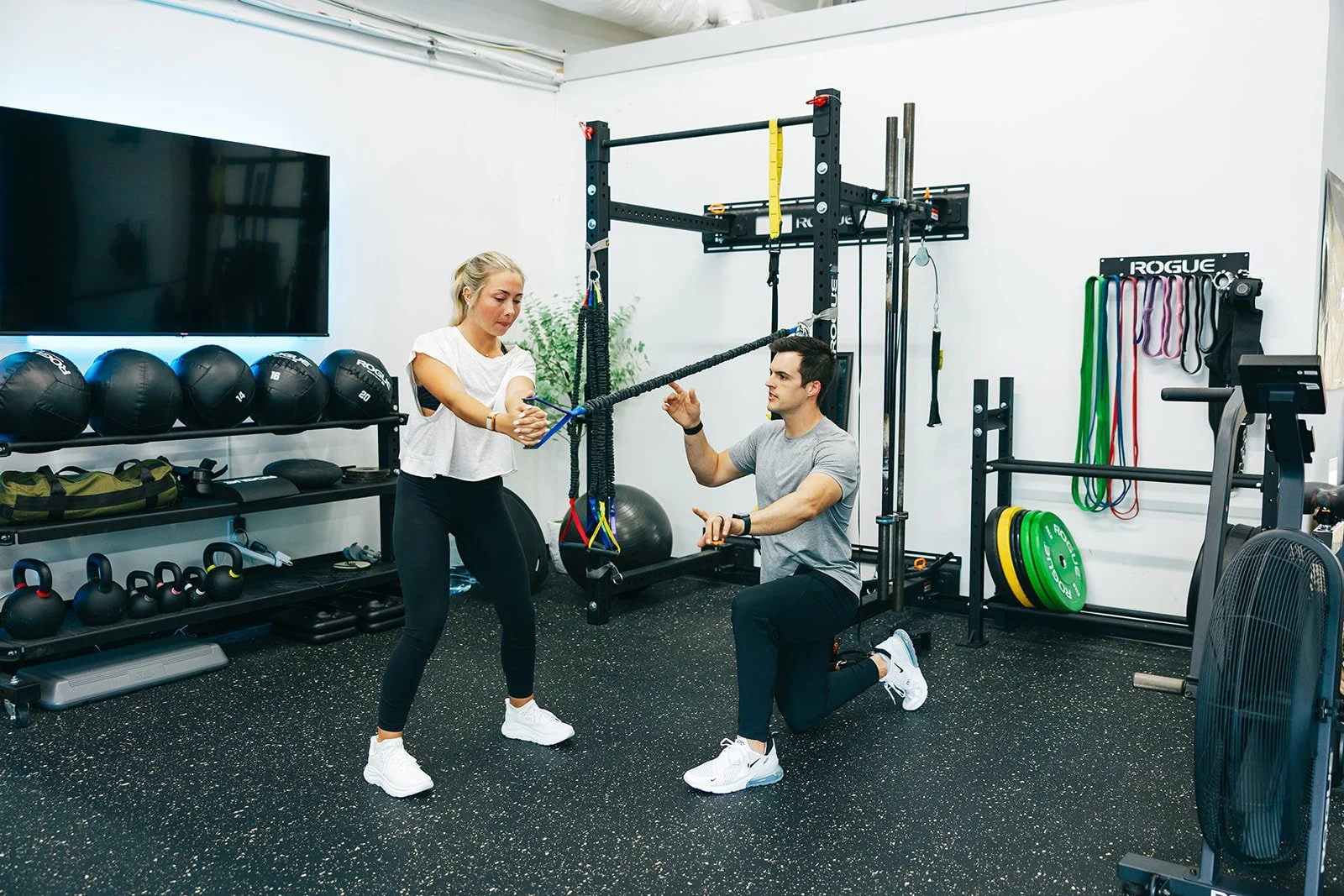 patient performing an exercise under guidance of a physical therapist