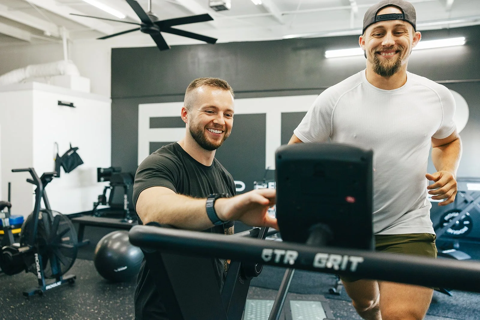Athlete running on the treadmill at Fine Tuned Performance under the supervision of a physical therapist.