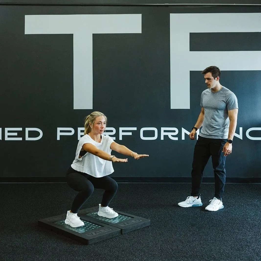 student athlete training under the guidance of a physical therapist at Fine Tuned Performance