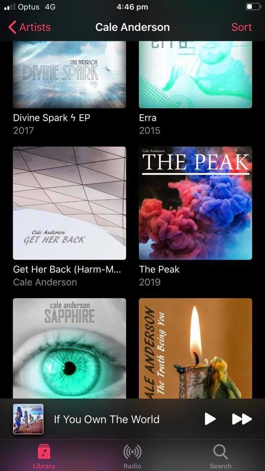 A screenshot of a music library on a mobile device displaying albums by Cale Anderson, including 'Divine Spark EP,' 'Erra,' 'Get Her Back,' 'The Peak,' 'Sapphire,' and 'The Thought Being You,' with a music player at the bottom playing 'If You Own The