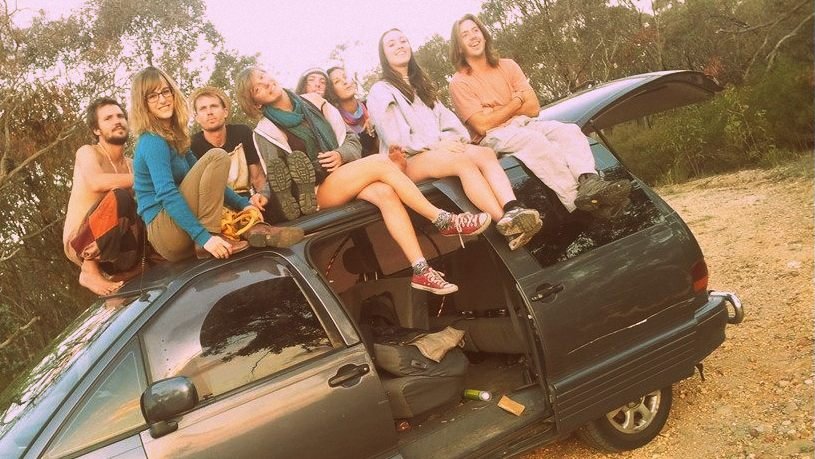 Cale Anderson & Crunchytown atop a mini van.