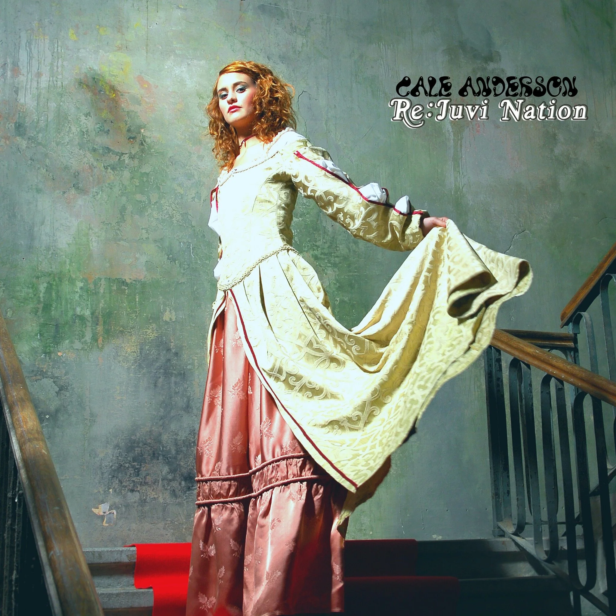 A woman with curly red hair wearing a vintage-style dress with a long, flowing skirt and ornate embroidery, standing on a red carpeted staircase against a textured, painted wall. She is holding up part of her gown and looking at the camera. Text on t