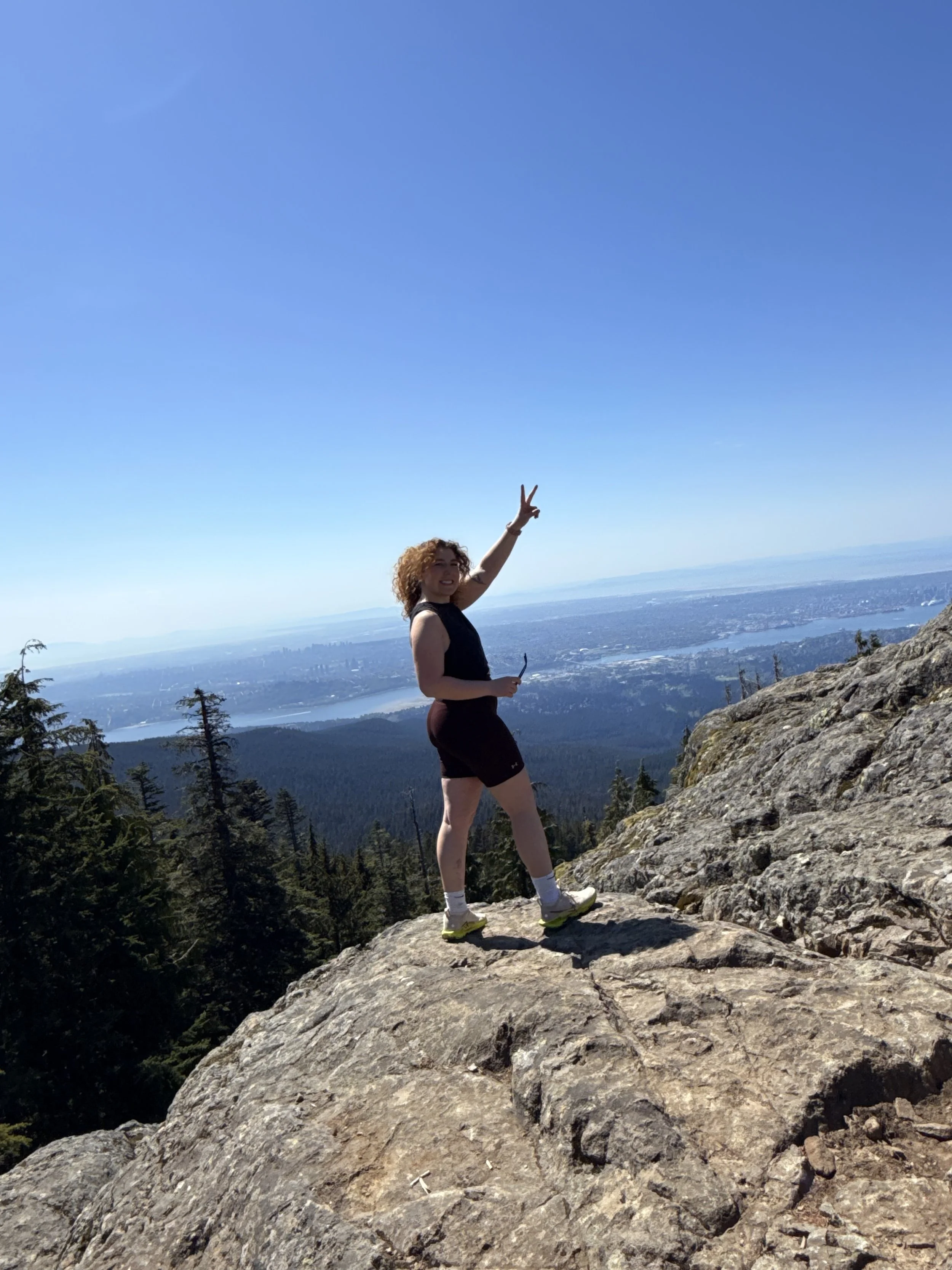 Mariangianine Carlucci, Registered Massage Therapist, hiking a mountain