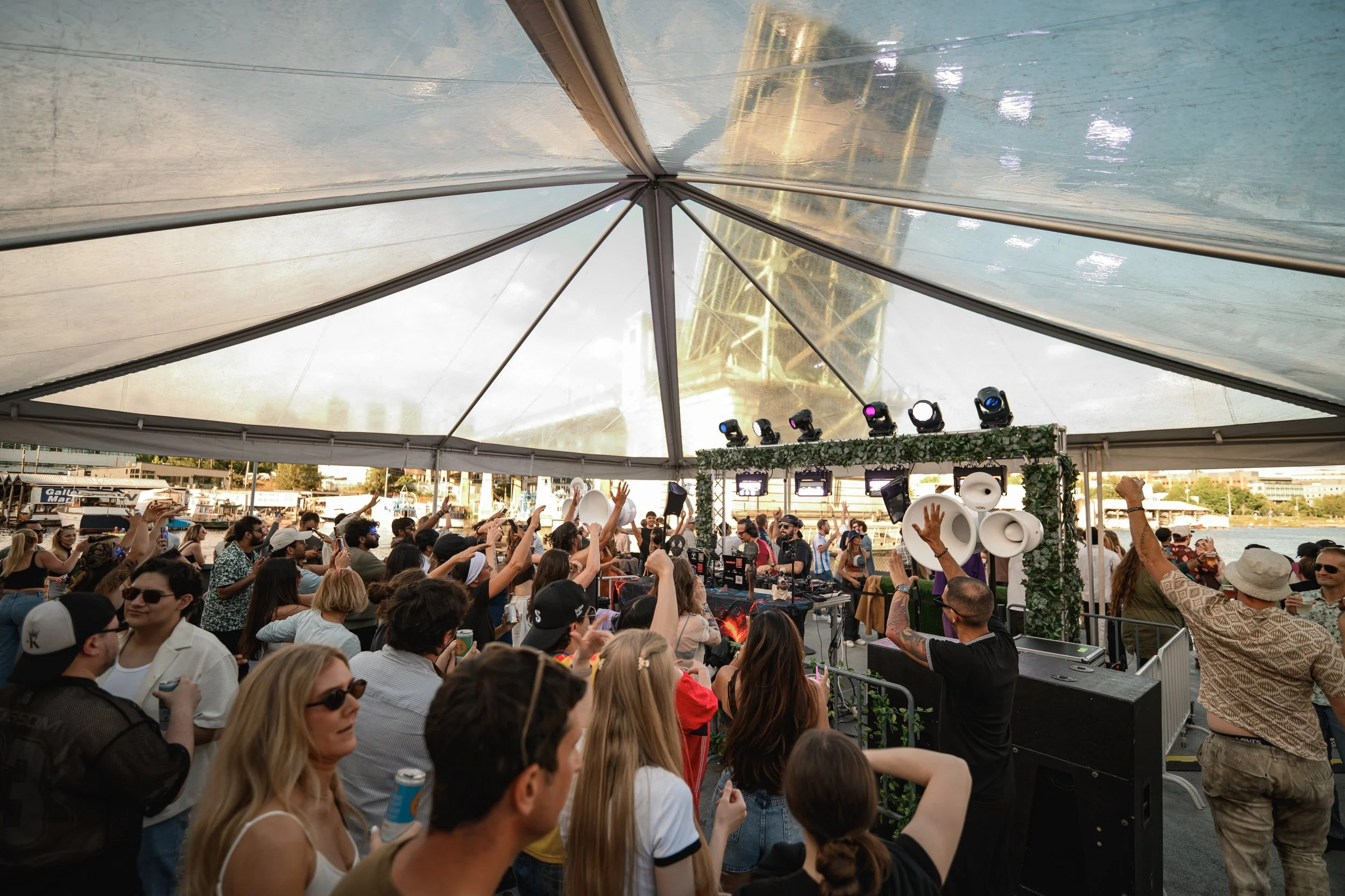 Crowd at a Seattle outdoor corporate event featuring live music mixed by professional private event DJ DRIIAN