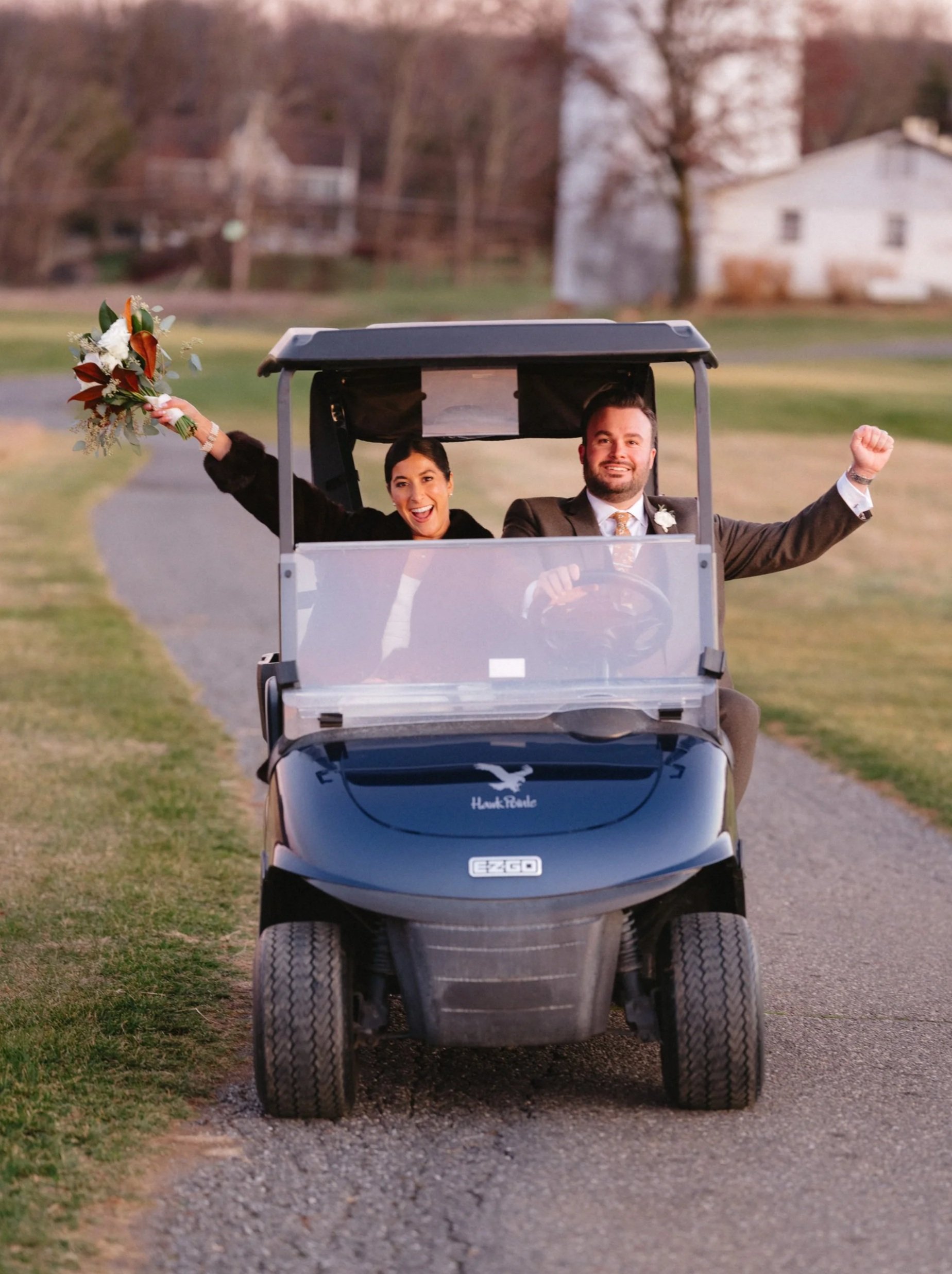 Hawk+Pointe+Golf+Club-+Washington+NJ-bride+and+groom+driving+away+in+little+buggy+after+the+wedding.jpg