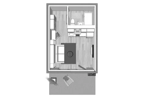 Floor plan of ADU apartment with a living area, kitchen, bathroom, and entryway area, including furniture layout and a small outdoor space.