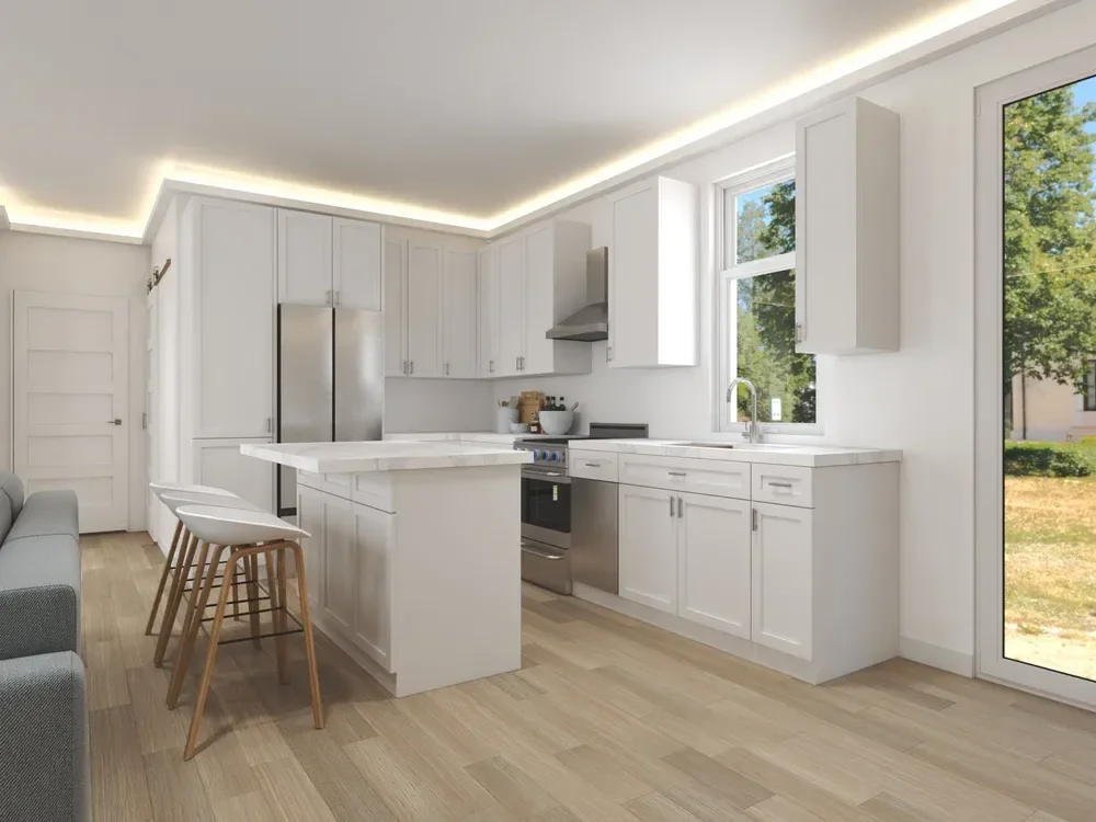 Backyard ADU Modern kitchen with white cabinetry, a center island with marble countertop, three white bar stools, stainless steel appliances, and large windows overlooking a garden.