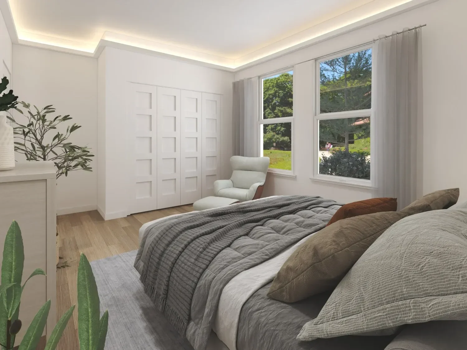 Backyard ADU Modern bedroom with a bed, cushioned chair, large window, white walls, wood flooring, and plants.