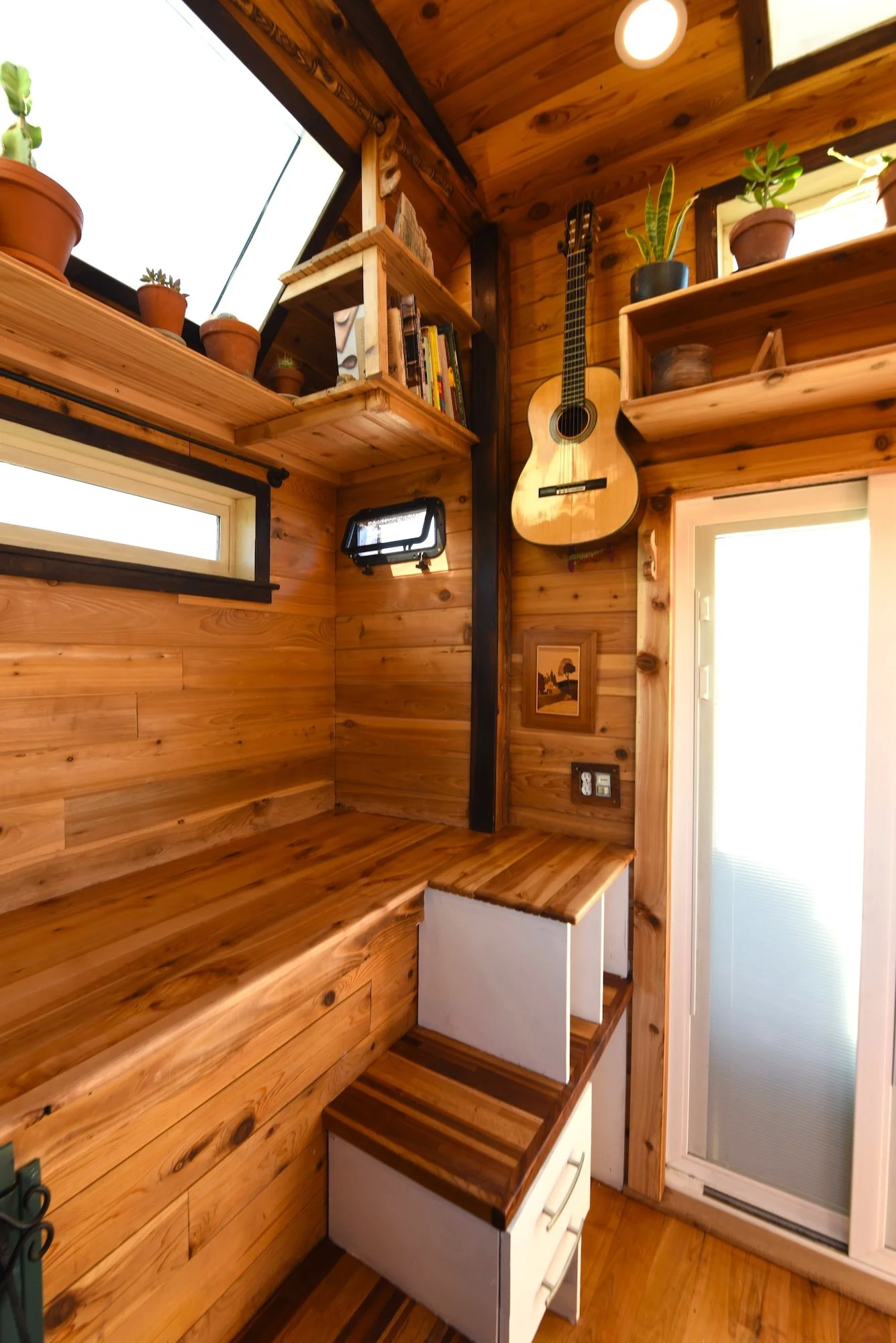 Guitar hanging on tiny house bump out