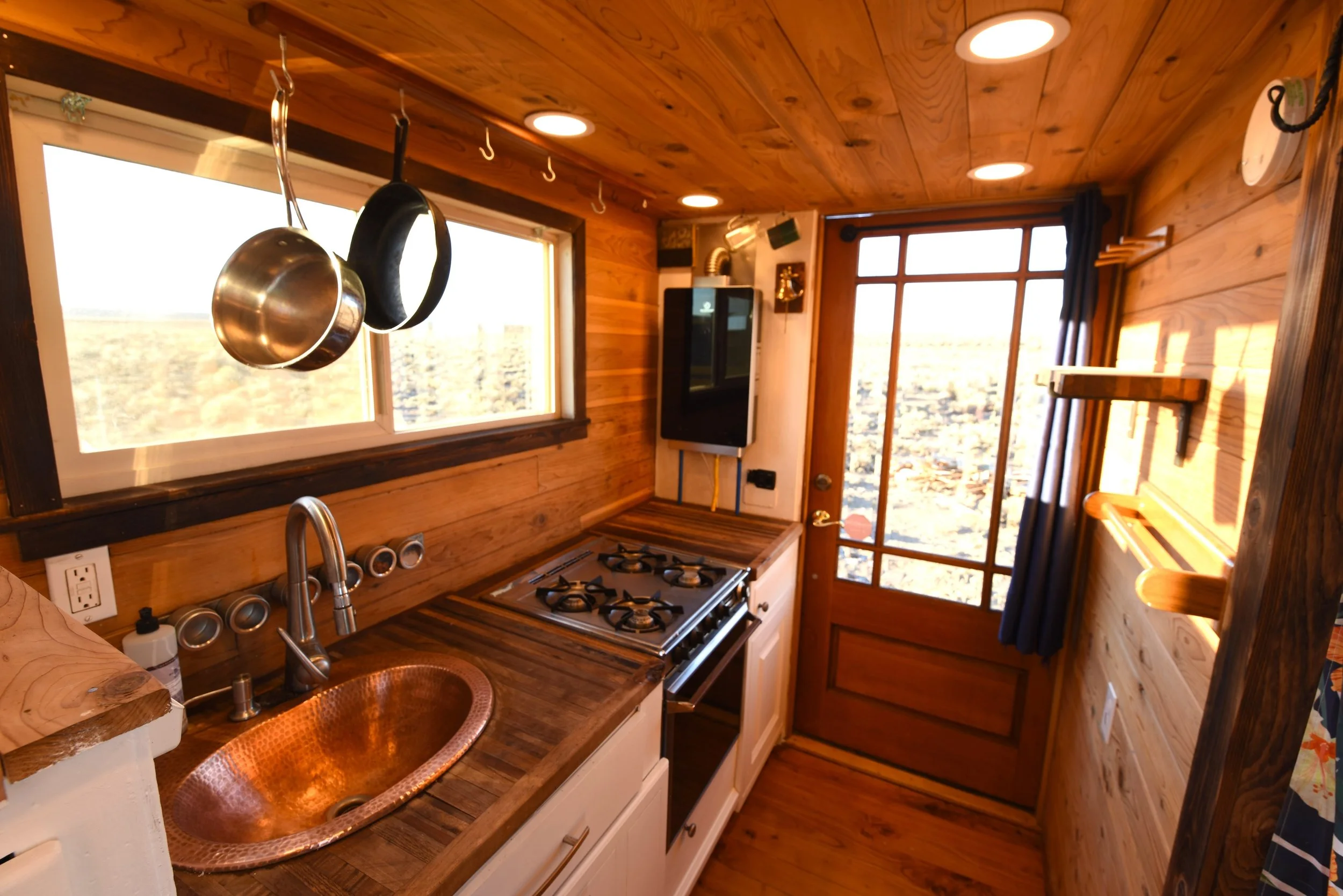 Cedar kitchen with stove and copper sink